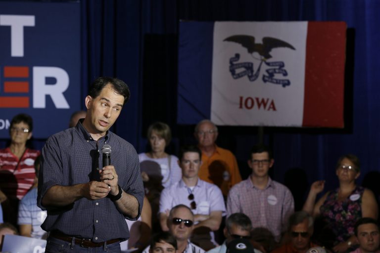 Wisconsin Gov. Scott Walker is the front-runner in Iowa, according to a new Monmouth University poll of likely Republican caucusgoers in the state. (AP Photo/Charlie Neibergall)