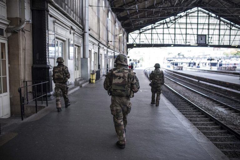 The train derailed while crossing a bridge, which saw multiple train cars fall into the Marne-Rhine canal. (AP Photo/Kamil Zihnioglu)
