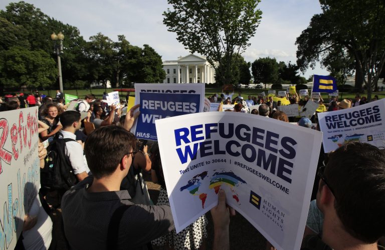 Refugees and community activists gather in front of the White House in Washington, Tuesday, June 20, 2017, during a rally in solidarity with refugees to commemorate World Refugee Day. (AP Photo/Manuel Balce Ceneta)