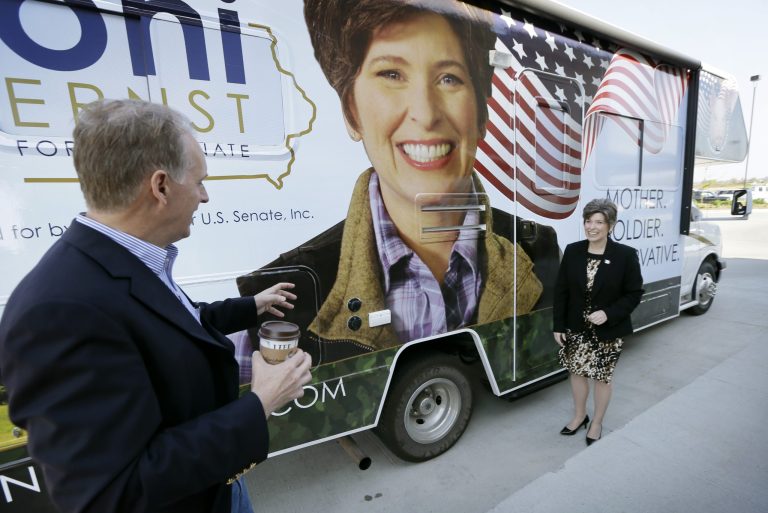 Republican Senatorial candidate Joni Ernst talks with Brad Boustead, of Urbandale, Iowa, after meeting with supporters, Wednesday, May 21, 2014, in Waukee. (AP Photo/Charlie Neibergall)