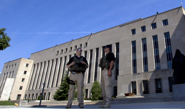 U.S. Marshalls guard the area outside of the federal U.S. District Court in Washington Saturday, June 28, 2014. (AP Photo/Jose Luis Magana)