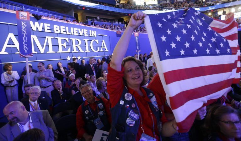 A delegate holds up an American flag during the Republican National Convention in Tampa, Fla., on Aug. 30, 2012. (AP/David Goldman)