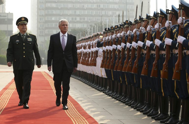 Accompanied by Chinese Minister of Defense Chang Wanquan, left, U.S. Secretary of Defense Chuck Hagel reviews a honor guard during a welcome ceremony at the Chinese Defense Ministry headquarters prior to their meeting in Beijing, Tuesday, April 8, 2014. (AP Photo/Alex Wong, Pool)