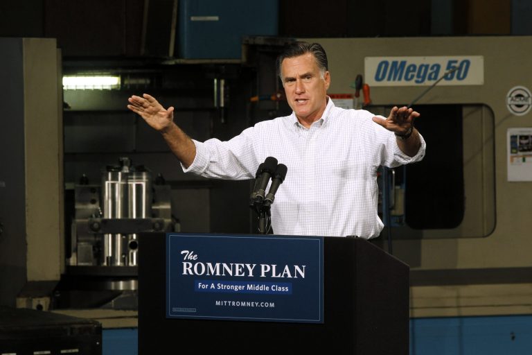This photo taken Aug. 7, 2012 shows Republican presidential candidate, former Massachusetts Gov. Mitt Romney campaigning in Elk Grove Village, Ill. Barack Obama's backers roll out a new ad assailing Mitt Romney's business record at Bain Capital, while the Republican candidate seeks to paint the Democrat as a big-government liberal.  (AP Photo/Charles Dharapak)