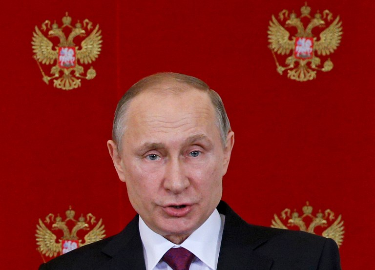 Russian President Vladimir Putin speaks at a joint news conference with Italian President Sergio Mattarella in the Kremlin in Moscow, Russia, Tuesday, April 11, 2017. Putin, speaking Tuesday after talks in Moscow with Italian President Sergio Mattarella, said the U.S. invaded Iraq based on false allegations that it had chemical weapons. (Sergei Chirikov/Pool Photo via AP)