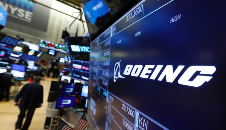 The logo for Boeing appears above a trading post on the floor of the New York Stock Exchange, Monday, July 22, 2019. 