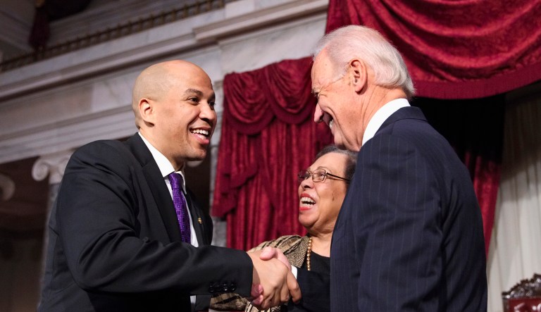Sen. Cory Booker, D-N.J., left, shakes hands with Vice President Joe Biden on Capitol Hill in Washington, Thursday, Oct. 31, 2013, after Biden administered a ceremonial Senate oath of office.  They are joined by Bookerâs mother, Carolyn Booker at center. Earlier, Booker was officially sworn in on the Senate floor.