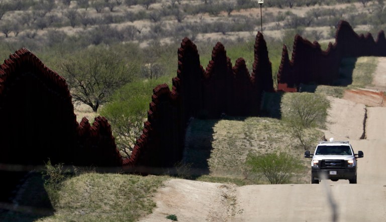 FILE--In this April 10, 2018, file photo, a Customs and Border Patrol agent patrols the international border near Nogales, Ariz. The U.S. Border Patrol says an agent has been wounded in a shooting in southern Arizona near the U.S.-Mexico border.