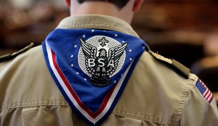 A Boy Scout wears an Eagle Scot neckerchief during the annual Boy Scouts Parade and Report to State in the House Chambers at the Texas State Capitol, Saturday, Feb. 2, 2013, in Austin, Texas. Perry says he hopes the Boy Scouts of America doesn't move soften its mandatory no-gays membership policy.