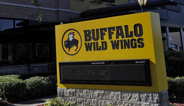 A Buffalo Wild Wings restaurant is shown Tuesday, Nov. 28, 2017, in Valrico, Fla. Fast food chain Arby's is buying Buffalo Wild Wings. The deal is expected to close in 2018's first quarter. It still needs the approval of Buffalo Wild Wings shareholders.
