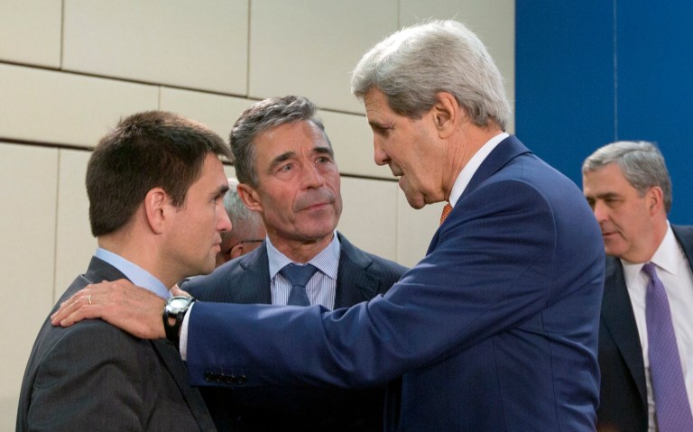 Ukrainian Foreign Minister Pavlo Klimkin, left, speaks with NATO Secretary General Anders Fogh Rasmussen, center, and U.S. Secretary of State John Kerry, second right, during a meeting of the NATO-Ukraine Commission at NATO headquarters in Brussels on Wednesday, June 25, 2014. Wednesdayâs meeting will discuss how NATO can help build Ukraineâs military capacities, including by creating targeted trust funds. (AP Photo/Virginia Mayo)