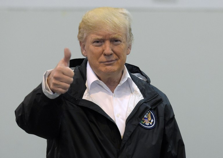 President Donald Trump gives a thumbs up after meeting people impacted by Hurricane Harvey during a visit to the NRG Center in Houston, Saturday, Sept. 2, 2017. (AP Photo/Susan Walsh)