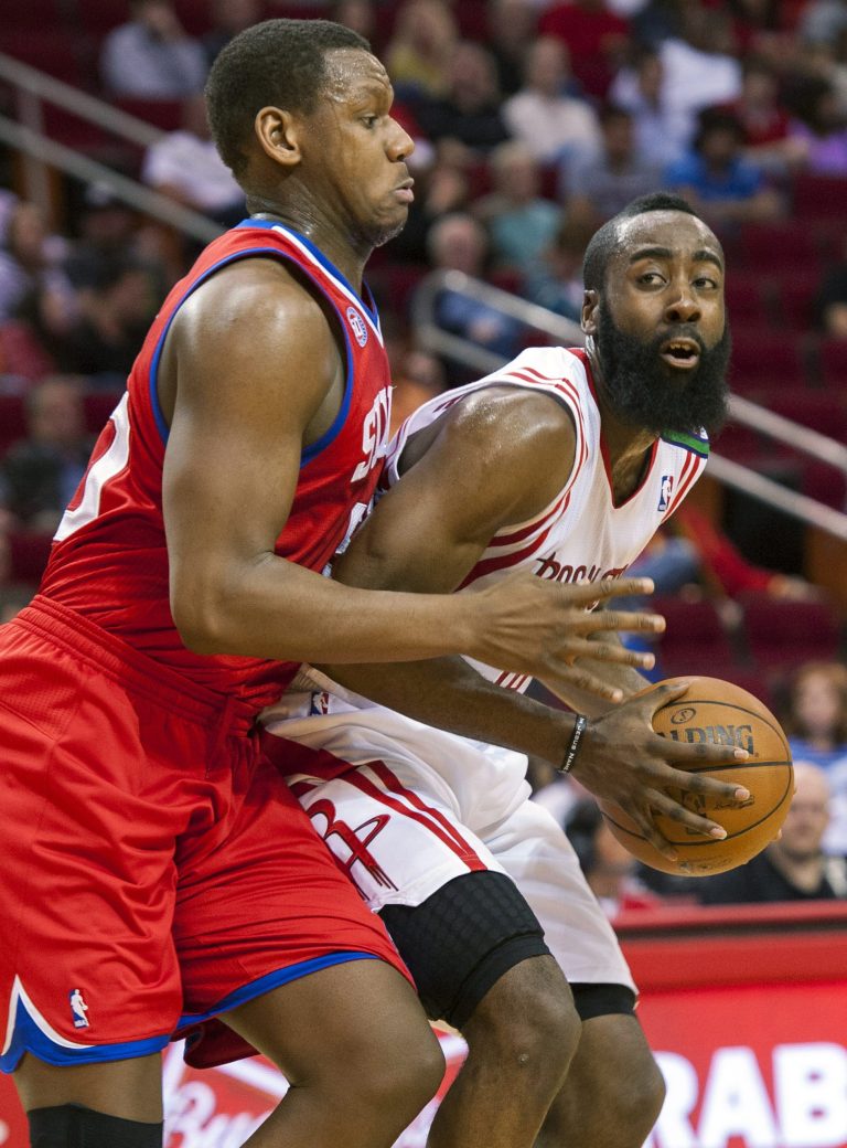   Philadelphia 76ers' Lavoy Allen, left, defends against Houston Rockets' James Hardin, right, during the first quarter of an NBA basketball game, Wednesday, Dec. 19, 2012, in Houston. (AP Photo/Dave Einsel)  