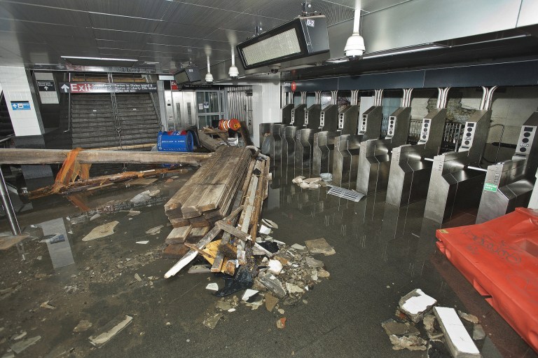   FILE- In this Oct. 30 2012 file photo provided by the Metropolitan Transportation Authority, the South Ferry subway station in New York City is filled with seawater and debris from Superstorm Sandy. More than three decades before Sandy, a state law and a series of legislative reports began warning New York politicians to prepare for a storm of historic proportions, spelling out scenarios eerily similar to what actually happened. (AP Photo/ Metropolitan Transportation Authority, File)  
