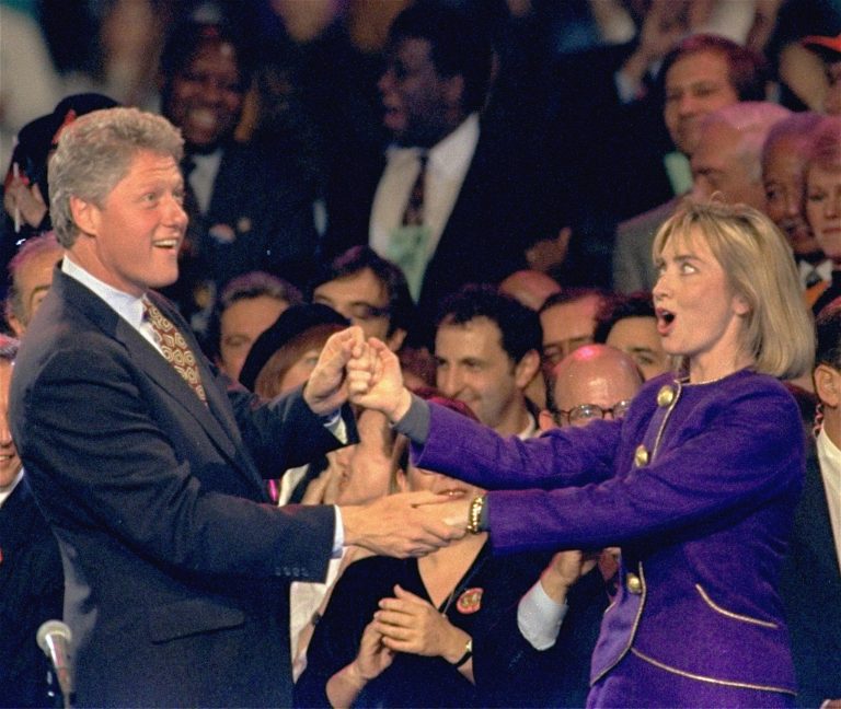 ** FILE ** In this file photo from Nov. 1, 1992, former President Bill Clinton and current Democratic presidential hopeful, Sen. Hillary Rodham Clinton, D-N.Y., dance on stage during a 
