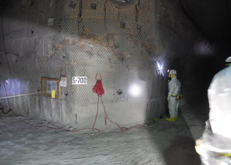 FILE - This April 2, 2014 file image provided by the U.S. Department of Energy shows workers underground inside the Waste Isolation Pilot Plant facility in Carlsbad, N.M., for the first time since the Feb. 14 radiological release. Workers at a West Texas nuclear waste disposal site are closely monitoring containers from Los Alamos National Lab, Tuesday, May 20, 2014, a day after New Mexico officials announced a type of kitty litter is believed to have caused a radiation leak at the federal government's troubled nuclear waste dump. (AP Photo/U.S. Department of Energy, File)