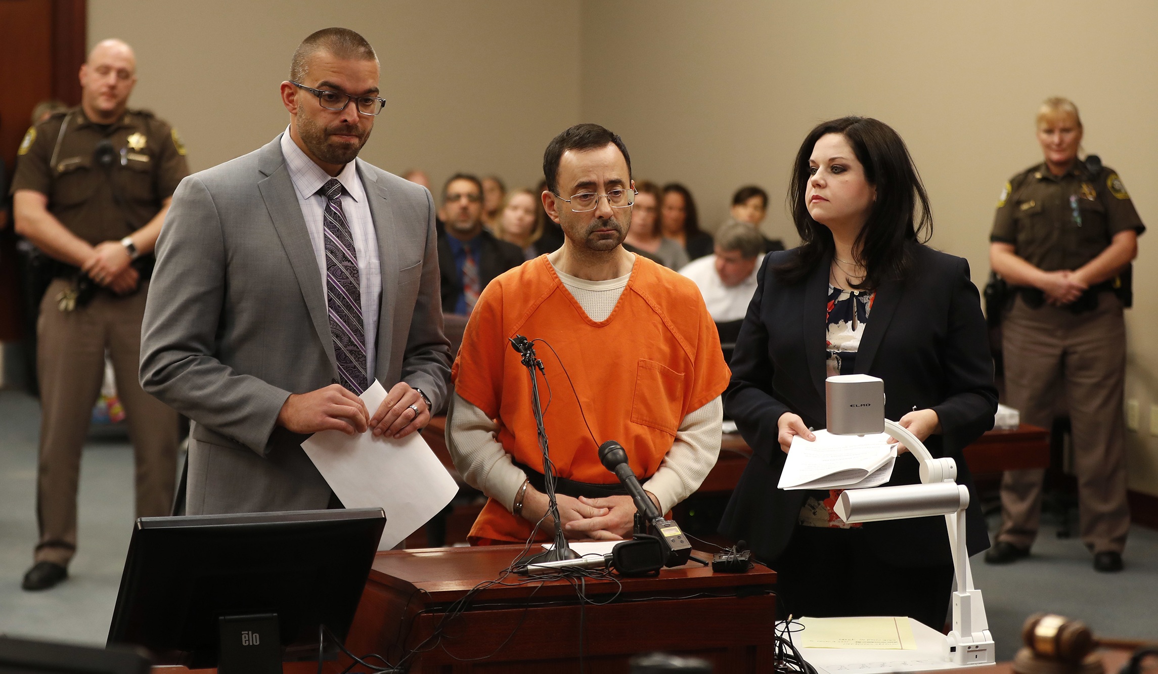 Ex-USA Gymnastics doctor Larry Nassar pleads guilty to multiple sexual assault charges