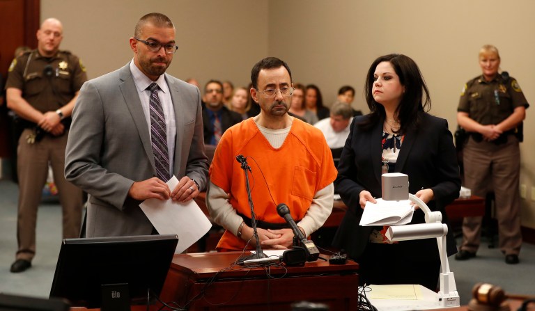 Dr. Larry Nassar, 54, appears in court for a plea hearing in Lansing, Mich., Wednesday, Nov. 22, 2017. Nasser, a sports doctor accused of molesting girls while working for USA Gymnastics and Michigan State University, pleaded guilty to multiple charges of sexual assault and will face at least 25 years in prison. (AP Photo/Paul Sancya)