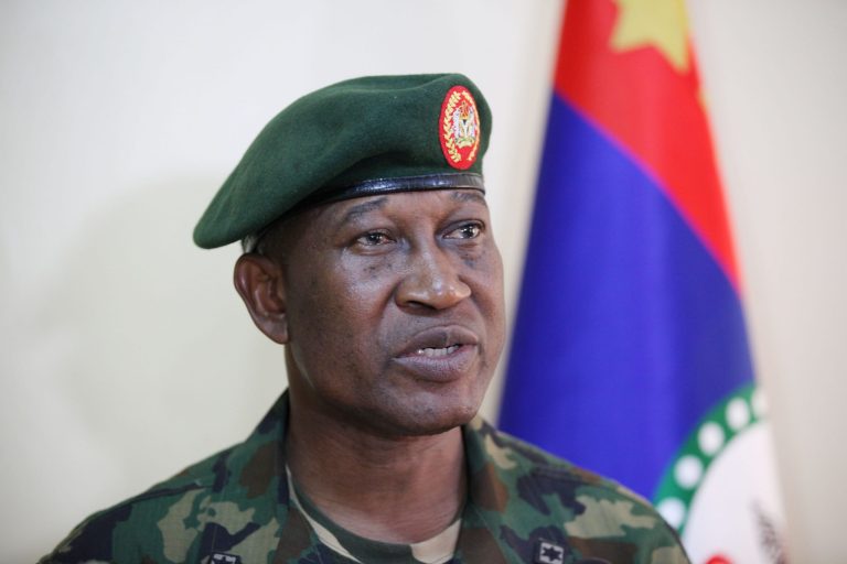 FILE - In this Thursday May 30, 2013 file photo, Maj. Gen. Chris Olukolade, Nigeria's top military spokesman speaks during an interview in Abuja, Nigeria. Nigeria's government and Islamic extremists from Boko Haram have agreed to an immediate cease-fire, officials said Friday, Oct. 17, 2014. The fate of more than 200 missing schoolgirls abducted by the insurgents six months ago remains unclear. Defense Ministry spokesman Maj. Gen. Chris Olukolade said their release is still being negotiated. (AP Photo/Jon Gambrell, File)