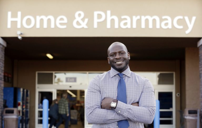 This photo taken Nov. 21, 2013 shows James Lott outside the Wal-Mart store where he works as a pharmacist in Bonney Lake, Wash. Lott, who lives in Renton, Wash., a suburb of Seattle, adds significantly to his six-figure job salary by day-trading stocks. It's not just the wealthiest 1 percent: Fully 20 percent of U.S. adults become rich for parts of their lives, wielding outsized influence on America's economy and politics. And this little-known group may pose the biggest barrier to reducing the nation's income inequality. While the growing numbers of the U.S. poor have been well documented, survey data provided exclusively to The Associated Press detail the flip side of the record income gap: the rise of the 