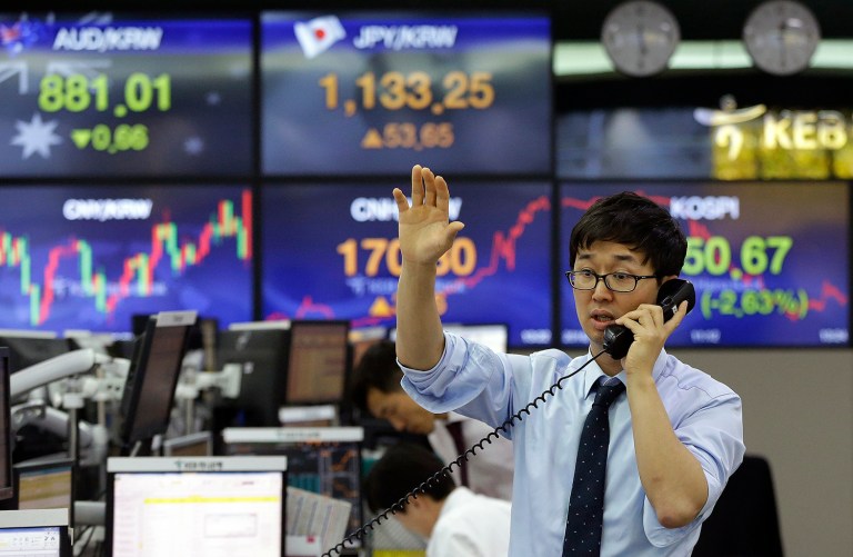 The prospect of a Trump presidency jolted markets around the world Wednesday. (AP Photo/Ahn Young-joon)