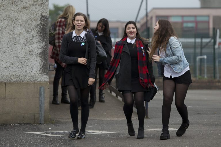 School pupils joke with each other as they leave a polling station, as anyone aged over 16 can vote in the Scottish independence referendum, in Edinburgh, Scotland, Thursday, Sept. 18, 2014.  Scots held the fate of the United Kingdom in their hands Thursday as they voted in a referendum on becoming an independent state, deciding whether to unravel a marriage with England that built an empire but has increasingly been felt by many Scots as stifling and one-sided. (AP Photo/Matt Dunham)