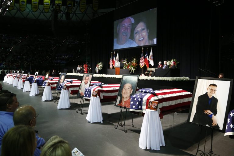 Casket sit in front of the stage of a memorial for firefighters who were killed in the West, Texas, fertilizer plant explosion prior to President Barack Obama's arrival, Thursday, April 25, 2013, at Baylor University in Waco,Texas. (AP Photo/Charles Dharapak)