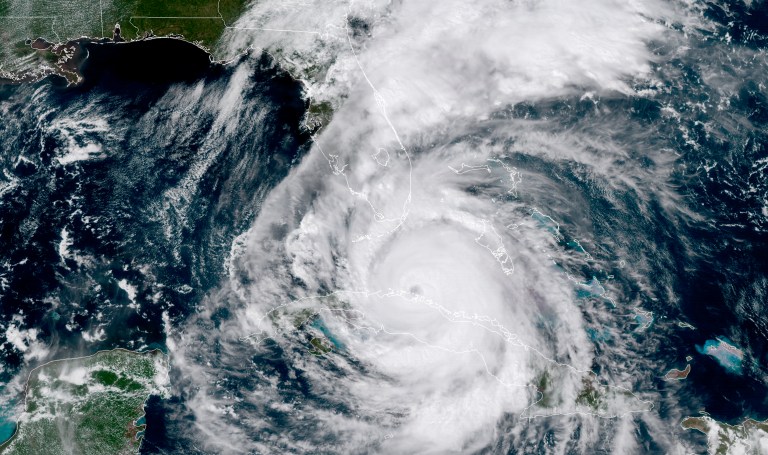 In this geocolor GOES-16 satellite image taken Saturday at 2:30 p.m. Eastern, the eye of Hurricane Irma moves northwest just off the coast of Cuba and south of Florida. (NOAA via AP)