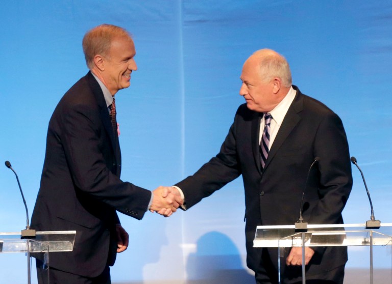 Illinois gubernatorial candidates Republican Bruce Rauner, left, and Democrat Gov. Pat Quinn greet before a debate at the DuSable Museum of African American History, Tuesday, Oct. 14, 2014, in Chicago. The debate is expected to focus on black voters. (AP Photo/Charles Rex Arbogast)