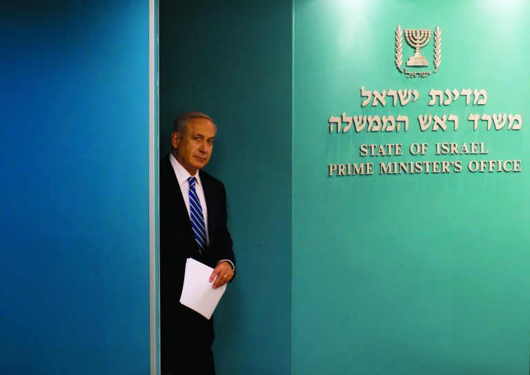 Israeli Prime Minister Benjamin Netanyahu arrives at a conference room at the Prime Minister's office in Jerusalem, Tuesday, Oct. 9, 2012. Netanyahu has ordered new parliamentary elections in early 2013, roughly eight months ahead of schedule. (AP Photo/Bernat Armangue)