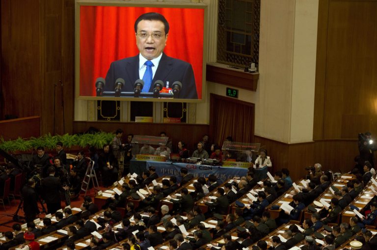 Chinese Premier Li Keqiang delivers a work report during the opening session of the annual National People's Congress in Beijing's Great Hall of the People, China, Wednesday, March 5, 2014. (AP Photo/Ng Han Guan)