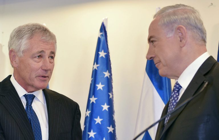 Israeli Prime Minister Benjamin Netanyahu, right, shakes hands with U.S. Defense Secretary Chuck Hagel while delivering remarks at his office on Friday, May 16, 2014 in Jerusalem. (AP Photo/Mandel Ngan, Pool)