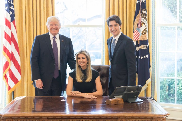 Ivanka Trump posed sitting at the Oval Office desk with U.S. and Canadian leaders beside her. (AP Photo/Andrew Harnik)