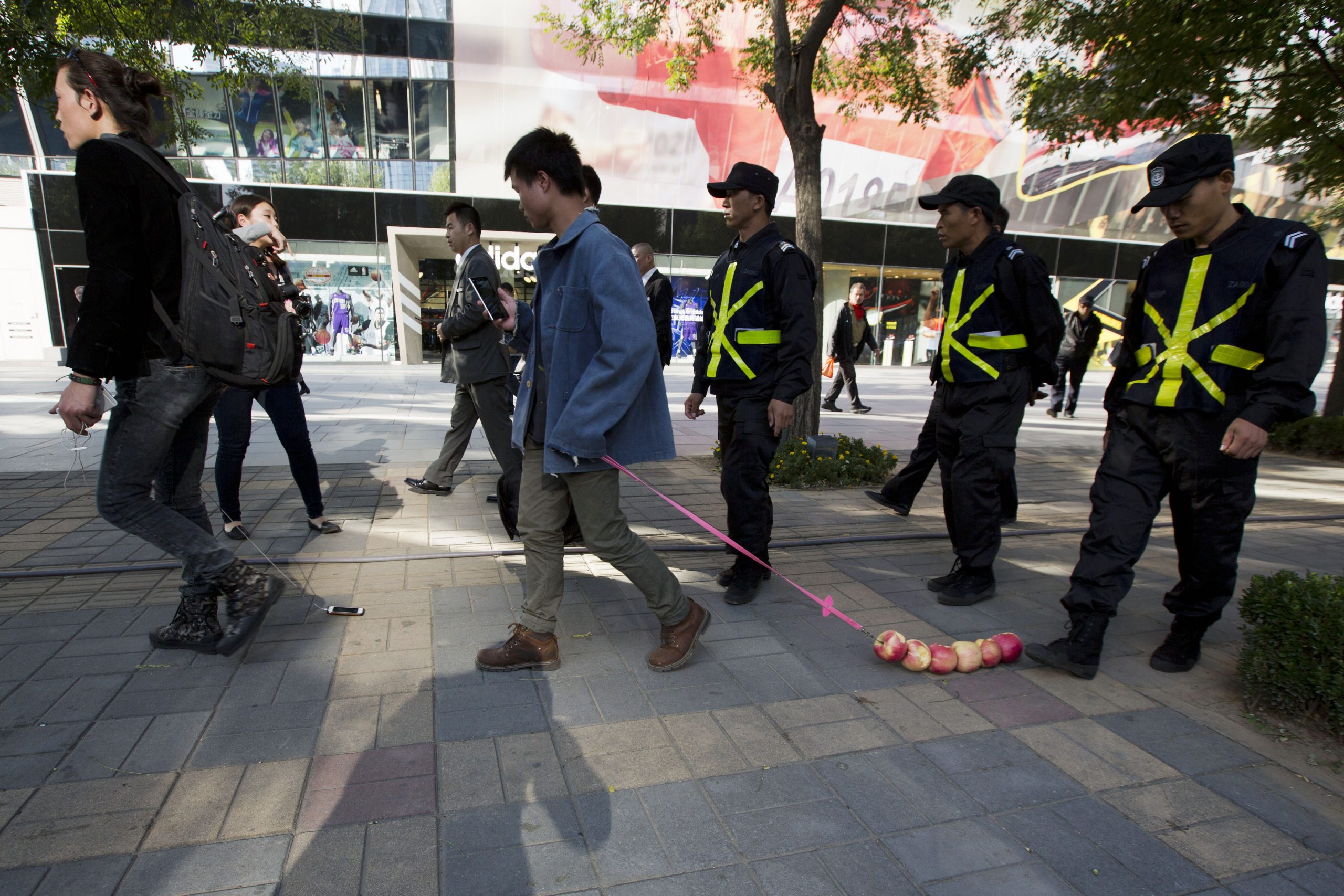 Image of Asia: Walking apples and a phone in China