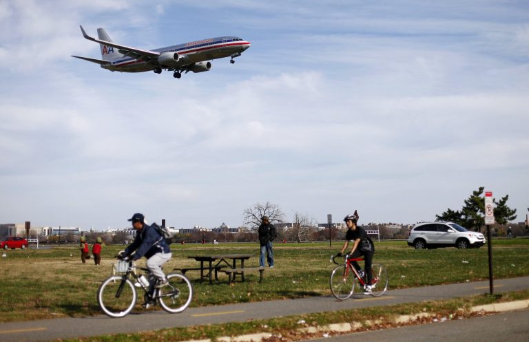 Visitors enjoy the warm weather at Gravelly Point Park an aircraft passes overhead before landing at Ronald Reagan National Airport in Arlington, Va. A new Republican bill would rename the park after Reagan's wife, former first lady Nancy Reagan. (AP Photo/Pablo Martinez Monsivais)