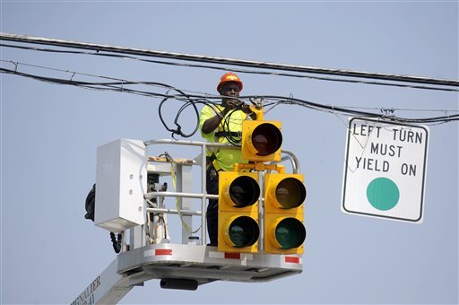 Half of Montgomery County's traffic signals lost power in a June 29 storm, and county police officers racked up more than 2,000 hours of overtime directing traffic and performing other tasks in the storm's aftermath. (AP photo)