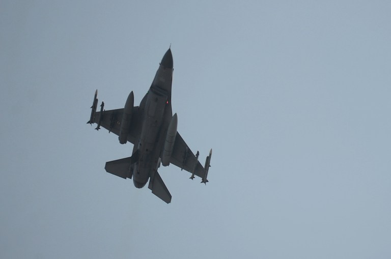 A Turkish Air Force fighter plane flies over the Incirlik Air Base, in Adana, southern Turkey, Thursday, Aug. 13, 2015. (AP Photo/Usame Ari/Cihan News Agency)