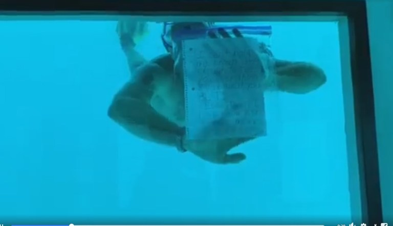 A man proposes to his girlfriend underwater.