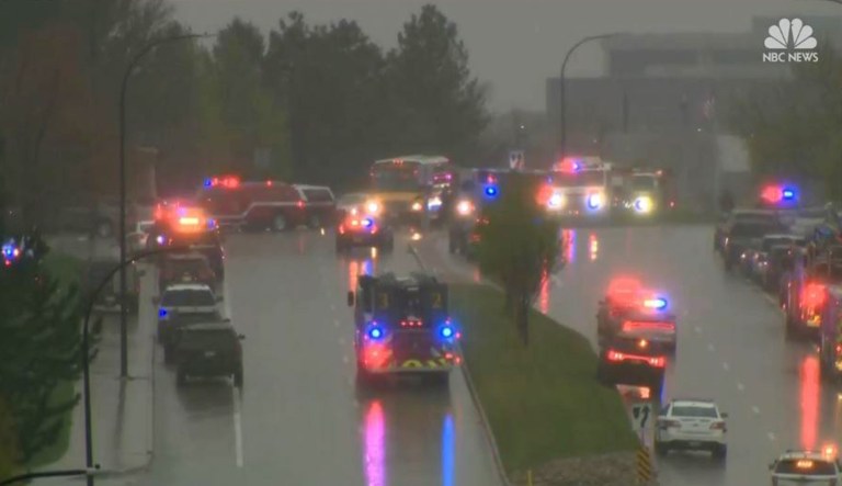 Emergency vehicles are seen after a shooting occurred Tuesday at STEM School Highlands Ranch in Highlands Ranch, Colo.