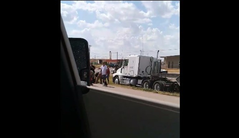 People are seen crowding around a shot truck in Texas.