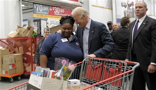 Vice President Joe Biden hugs Ivey Stewart, a Costco employee, after shopping at Costco in Washington, Thursday, Nov. 29, 2012. Biden went shopping for presents and to highlight the importance of renewing middle-class tax cuts so families and businesses have more certainty at this critical time for our economy. (AP Photo/Susan Walsh)