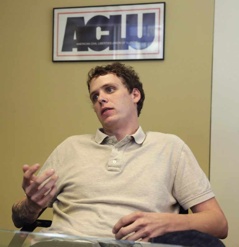 In this Aug. 7, 2014 photo, Jon Daniel speaks during an interview with The Associated Press at the American Civil Liberties Union of Illinois office in Chicago. Daniel, who created a spoof Twitter account in the name of Peoria Mayor Jim Ardis, is taking his case to federal court after police raided his home. Ardis saw the account as an attempt to steal his identity. Daniel says the raid violated his constitutional rights. The police response also ignited a debate about online satire and free speech. (AP Photo/M. Spencer Green)