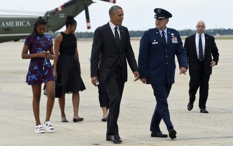 President Barack Obama, first lady Michelle Obama and daughter Sasha walk off of Marine One and head towards Air Force One at Andrews Air Force Base, Md., Friday, Aug. 7, 2015. (AP Photo/Susan Walsh)