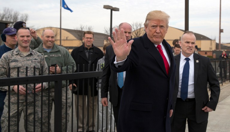 President Trump greeted members of the military before boarding Air Force One en route to Palm Beach, Fla. (AP Photo/Carolyn Kaster)
