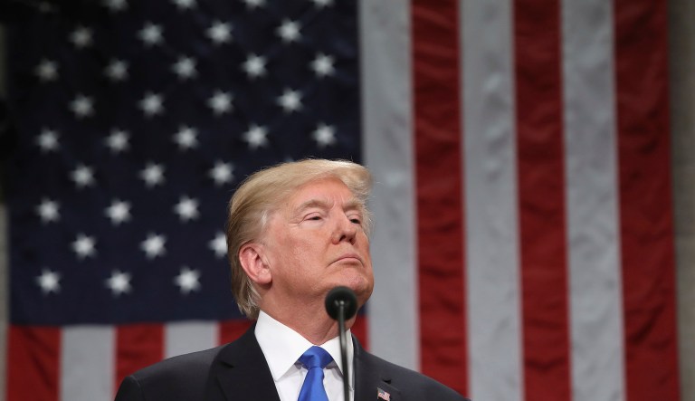 The reverence President Trump's populist, working-class base has for him is well known. His relationship with traditional Republicans, including those within the Koch donor network, is more complicated. (Win McNamee/Pool via AP)