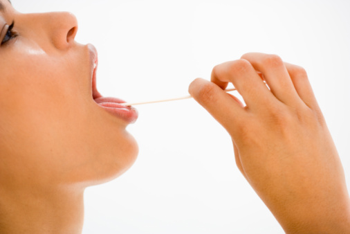 Woman with a tongue depressor