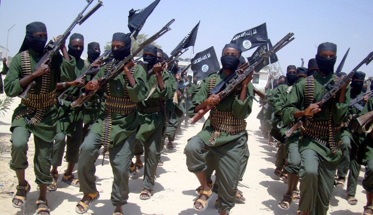 Al-Shabab fighters march with their weapons during military exercises on the outskirts of Mogadishu, Somalia. In early April, a few dozen U.S. troops from the 101st Airborne Division were deployed to Somalia to advise that country in its fight against al-Shabab extremists. (AP Photo/Mohamed Sheikh Nor, File)