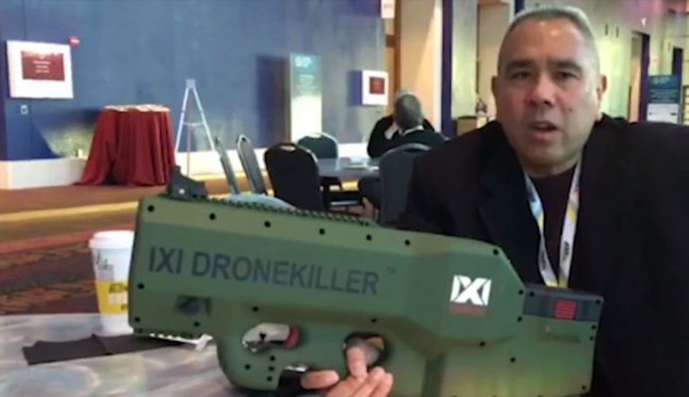 In this photo, Andy Morabe, director of business development for IXI Technology, talks about his Drone Killer device, which the first and only hand-held device that can take down a drone without blowing it up. (Screenshot via Washington Examiner video)