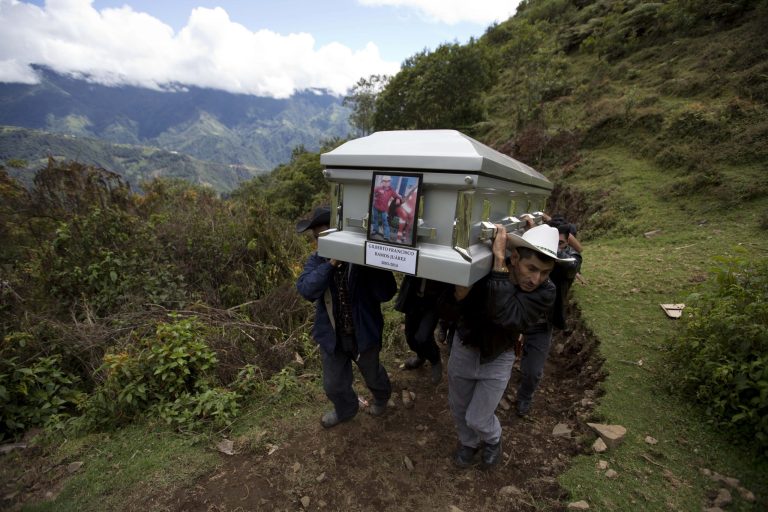 Relatives carry to a local cemetery, the coffin containing the remains of Gilberto Francisco Ramos Juarez, a Guatemalan boy whose decomposed body was found in the Rio Grande Valley of South Texas, in San Jose Las Flores, Guatemala, Saturday (AP Photo/Moises Castillo)