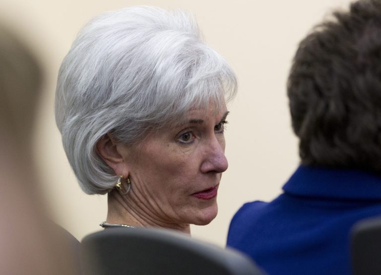 Health and Human Services Secretary Kathleen Sebelius sits in the audience before President Barack Obama arrives to speak about the new health care law, Tuesday, Dec. 3, 2013, in the South Court Auditorium in the Eisenhower Executive Office Building on the White House complex in Washington. The President argued that his health law is preventing insurance discrimination against those with pre-existing conditions and is allowing young people to stay on their parents' coverage until age 26. (AP Photo/Carolyn Kaster)